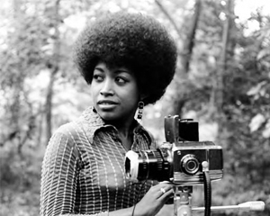 young african american woman with a camera