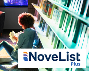 African American reading a book from a shelf at the Jacksonville Public Library