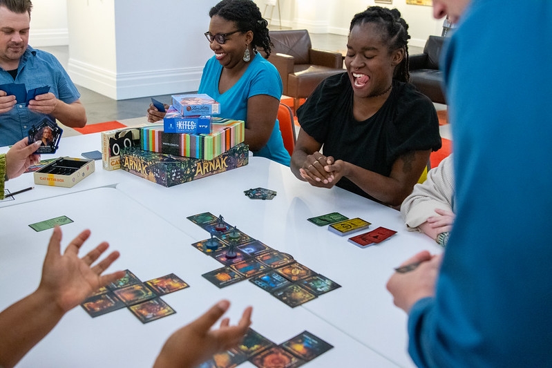 Photo of adults playing board games