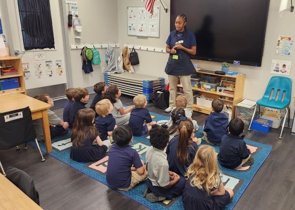 A librarian talking to students in a classroom
