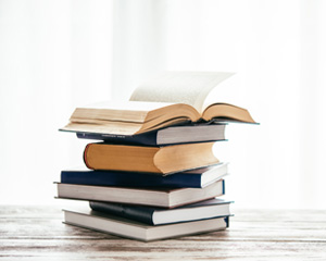 A stack of books representing the Marketing Your Book to Jacksonville Publc Library service
