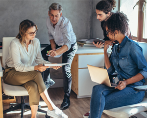 group of people working on a small business plan at the library