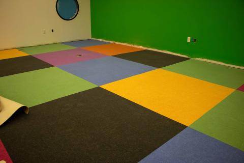 Colorful carpeting being installed at Webb Wesconnett Regional Library