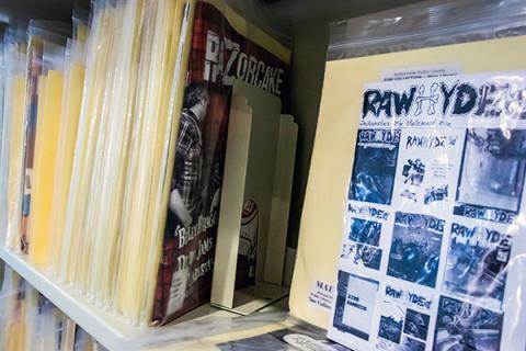 close up of zines on a library shelf