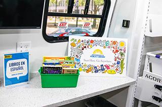interior of bookmobile with library card