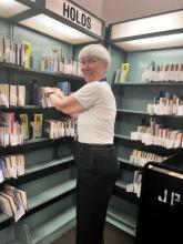 A photo of a smiling volunteer at Jacksonville Public Library.