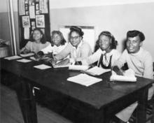 photo of African American students sitting at a table
