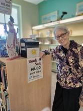 Photo of smiling volunteer at the library.
